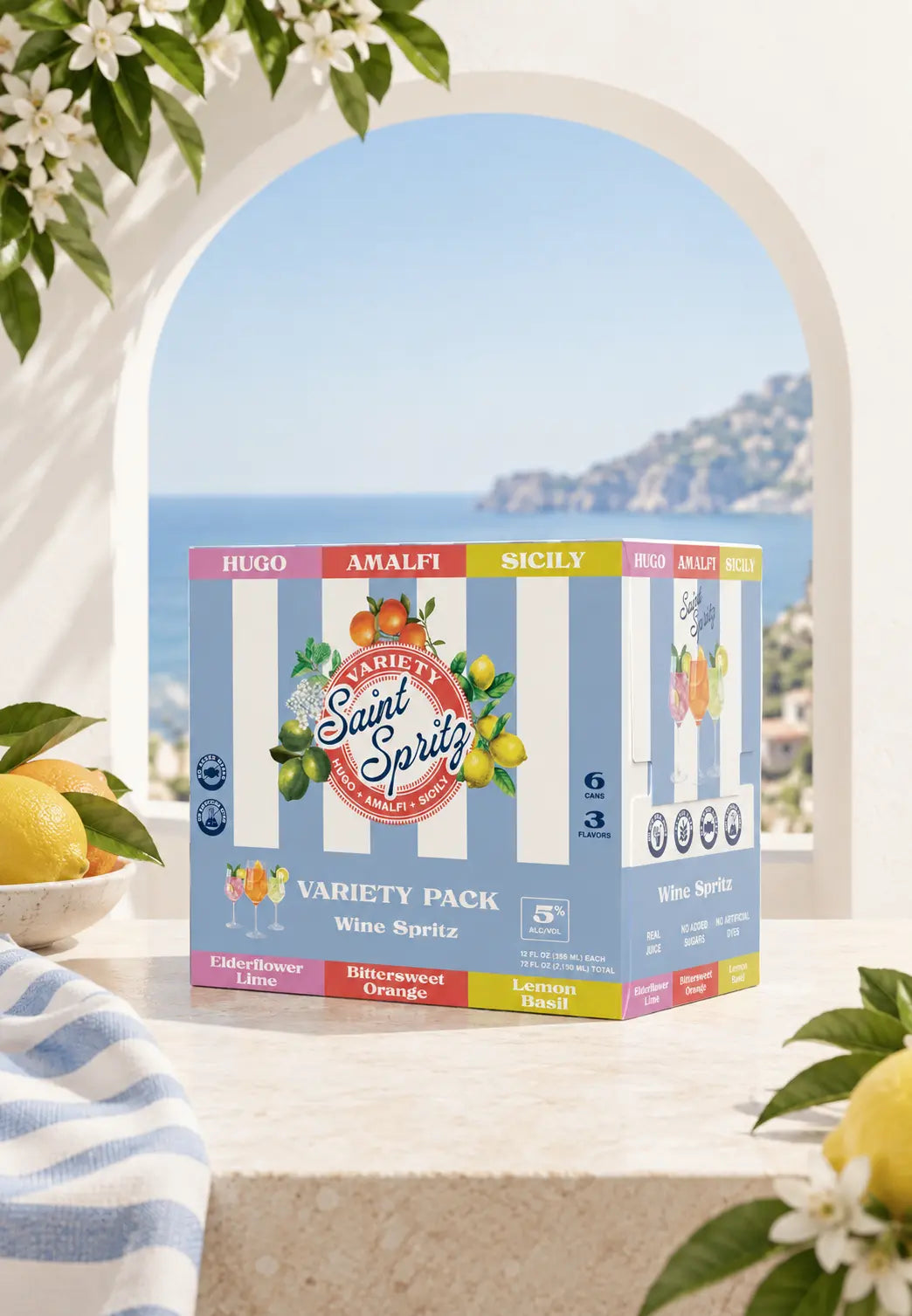 Saint Spritz Variety Pack sitting on a sunlit stone table overlooking the Italian coast